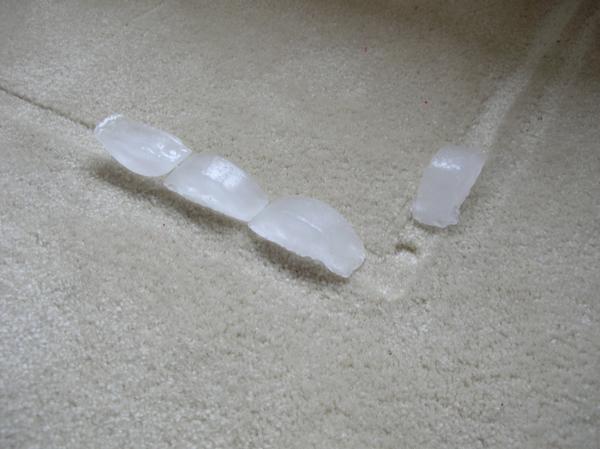 Ice-cubes along the carpet indentation