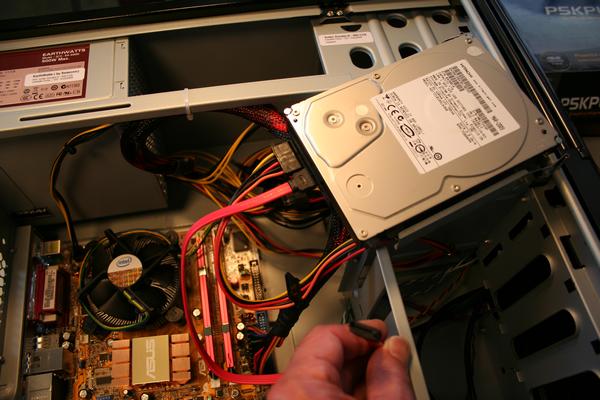 Plugging in the SATA cable and the power cable to the Hard Drive 